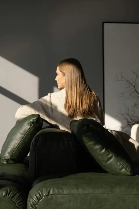 Relaxing on a sofa in afternoon sunlight